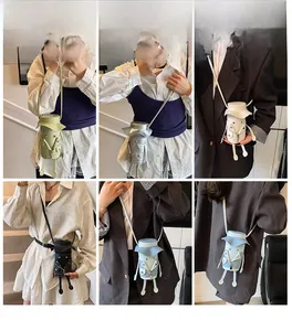 Detailed model views of unique doll-shaped mini crossbody bags in various pastel colors