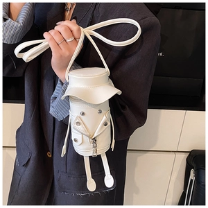 Detail of creative white character mini bag with rivet eyes and leg decorations