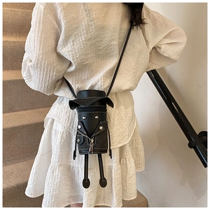 Creative black mini crossbody bag featuring a humanoid jacket design with metal studs