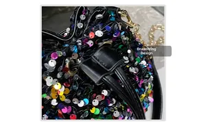 Close-up of vibrant multi-color sequins and black drawstring closure on bucket bag