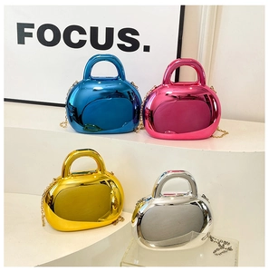 Close-up of four colored metallic acrylic shell bags with glossy mirror electroplating