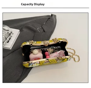 Detail view of yellow beaded evening bag capacity showing space for phone and makeup
