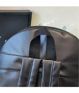 Detailed close-up of creative hedgehog backpack showing matte PU leather and braided handle