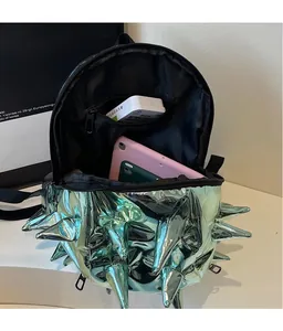 Detail of mint green metallic hedgehog backpack showing spacious interior for tablets