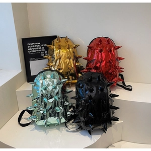 Close-up of stylish metallic mini backpacks with unique 3D spiky design in four colors