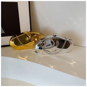 Detail view of gold and silver irregular acrylic clutches with high-gloss mirror finish