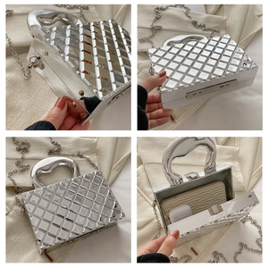 Detailed views of a silver metallic quilted box bag with a top handle and chain strap