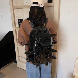 Glossy black patent leather backpack with punk hedgehog spikes and adjustable straps