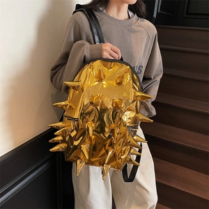 Futuristic gold metallic backpack with unique 3D hedgehog spikes for women