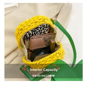 Internal capacity of pineapple woven bag showing wallet, notebook and cosmetics