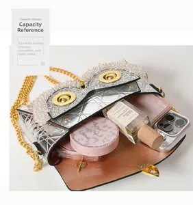 Interior view of owl-shaped crossbody bag showing capacity for phone and cosmetics
