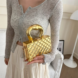 Glossy gold quilted metal box handbag with elegant chain strap and curved top handle
