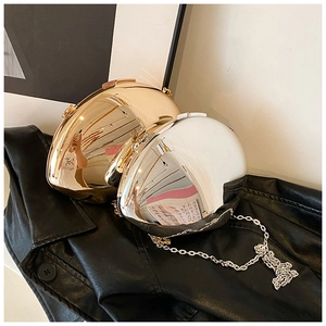 Detail of gold and silver heart-shaped acrylic evening bags with polished mirror finish