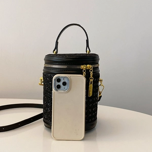 Fashionable black rhinestone cylinder crossbody bag with golden metal ring handles and strap
