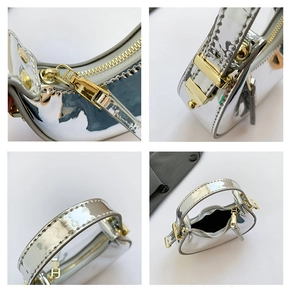 Detail view of silver mirror mini bag featuring golden zippers and precise stitching