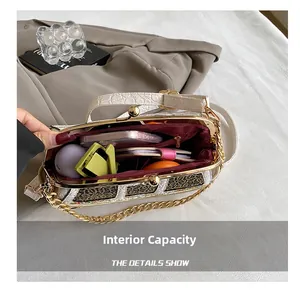 Detail showing the internal multi-compartment storage and red lining of this car-shaped bag