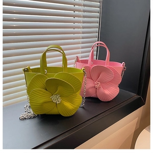 Detail view of 3D floral PU leather bucket bag with bead core and metal chain strap