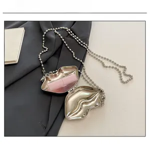 Detailed capacity view of a silver lip-shaped acrylic mini bag showing a single lipstick fit