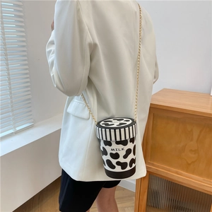 Creative milk box shaped crossbody bag with cow pattern and golden chain strap for women