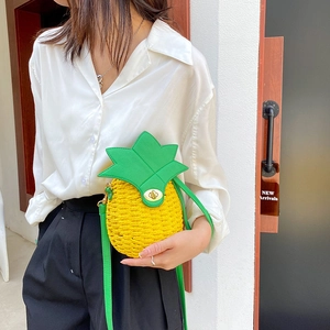 Chic pineapple shaped woven shoulder bag with green strap and gold metal lock