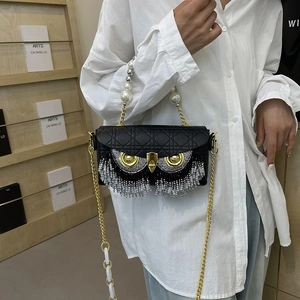 Quilted owl-shaped handbag with rhinestone fringe and gold chain shoulder strap