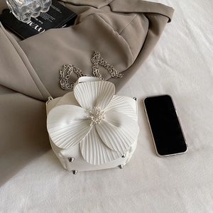 White flower shaped petal bucket bag with silver chain strap and pearl details