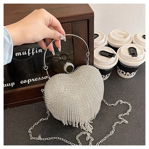 Silver heart-shaped evening clutch bag with sparkling rhinestones and long tassel fringe
