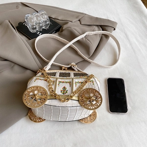 White carriage-shaped crocodile texture handbag with gold wheels and chain strap