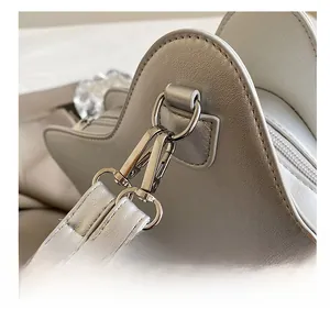 Close-up of premium metal swivel hook and stitching on star-shaped shoulder bag
