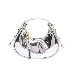 Glossy silver metallic half-moon handbag with gold hardware and sleek top handle