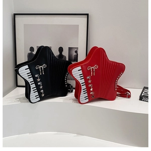 Detail view of star-shaped bags with piano key pattern and metallic star charms