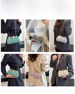 Detailed view of sparkly glitter box clutches with gold leaf clasps in five colors