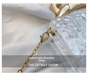 Detail shot of the ice-cracked acrylic evening bag with a detachable gold chain strap