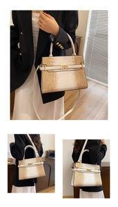 Detail of gradient crocodile embossed leather tote with gold twist lock and shoulder strap