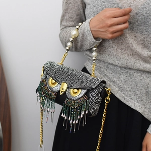 Quirky owl-shaped crystal clutch bag with pearl handle and colorful bead fringe