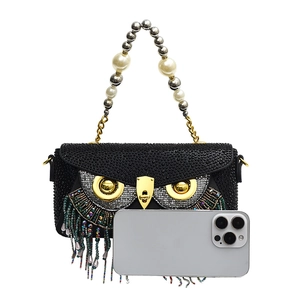 Quirky owl-shaped black rhinestone evening clutch bag with fringe tassels and pearl handle