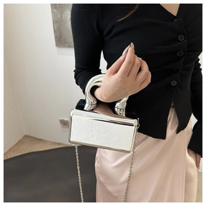 Silver mirror acrylic evening bag with white textured panel and thick metal handle