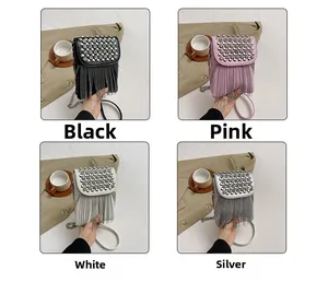 Detail view of mini crossbody bags with studded rhinestones and hanging metal tassels