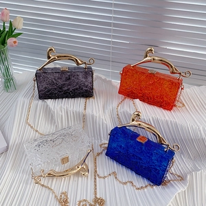 Acrylic evening clutch bags with ice-cracked texture and gold leopard handles