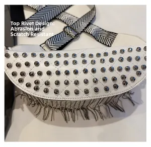 Detail of white punk waist bag with silver studs and durable leather texture