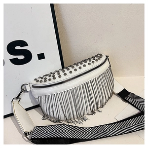 Detail of white leather waist bag with punk studs, chain fringes and chevron strap