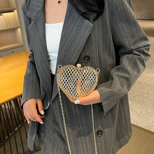 Golden heart shaped hollow metal clutch bag with elegant chain strap for women