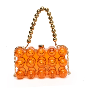 Orange pearl acrylic evening bag with gold bead handle and metallic chain strap