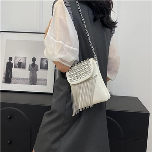 White studded crossbody bag with chain fringe tassels and silver punk rivet details