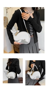 Détail du sac dauphin mignon en cuir blanc avec finitions à paillettes argentées
