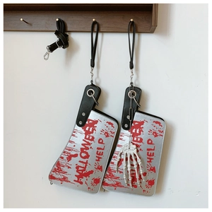 Halloween knife bags with bloody lettering and adjustable straps hanging on a wall