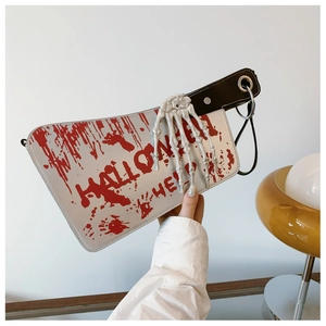 Close-up of Halloween cleaver bag with blood splatter and skeleton hand detail