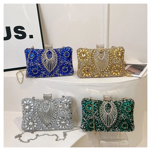 Macro shot of four sparkling rhinestone evening clutches in blue, gold, silver and green