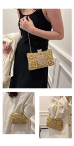 Detailed close-up of golden evening clutch with crystals and metal chain strap