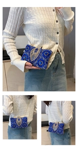 Detail of royal blue rhinestone evening clutch bag with sparkling silver feather pattern